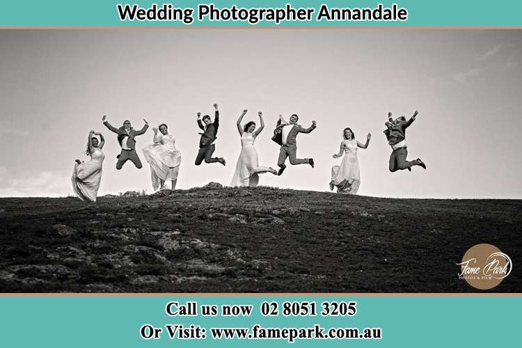 Jump shot photo of the Groom and the Bride with the entourage Annandale NSW 2038