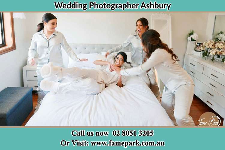 Photo of the Bride and the bridesmaids playing on bed Ashbury NSW 2193