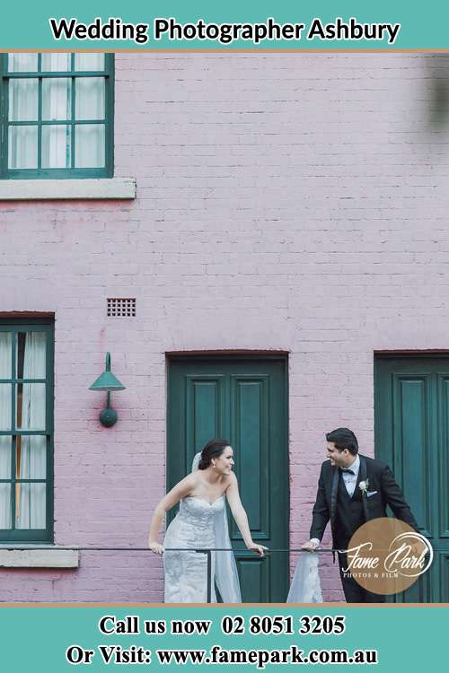 Photo of the Bride and the Groom looking each other at the balcony Ashbury NSW 2193