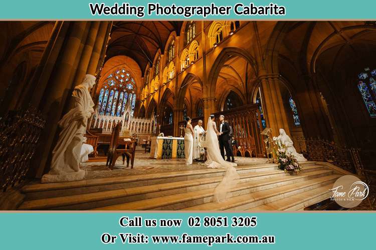 Photo of the Bride and the Groom at the altar Cabarita NSW 2137