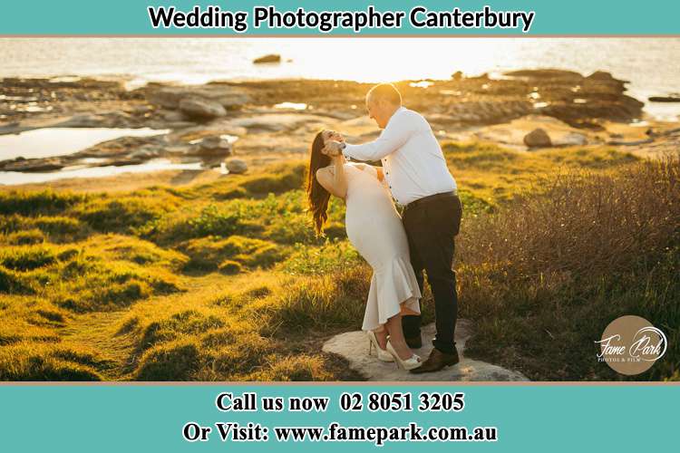 Photo of the Bride and the Groom dancing near the lake Canterbury NSW 2193