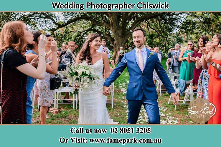 Photo of the Bride and the Groom showering bubbles by the visitors Chiswick NSW 2046