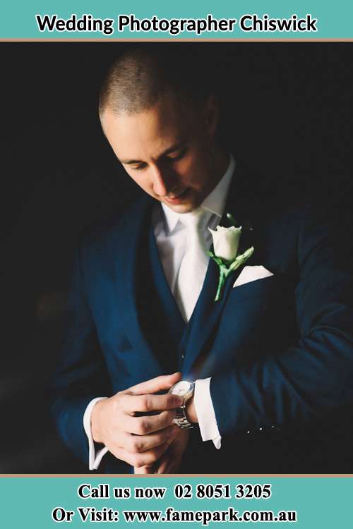 Photo of the Groom checking his watch Chiswick NSW 2046