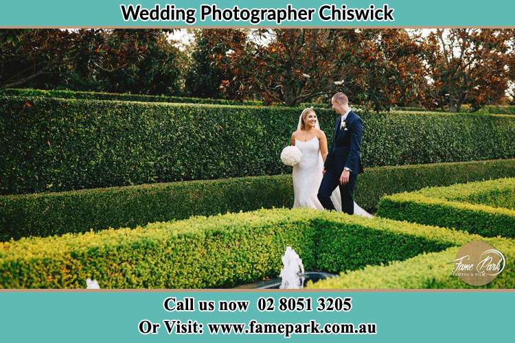 Photo of the Bride and the Groom walking at the garden Chiswick NSW 2046