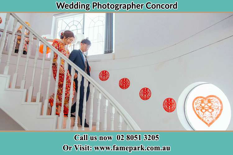 Photo of the Bride and the Groom going down the stair Concord NSW 2137