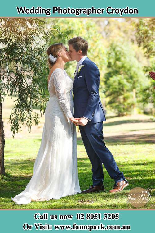 Photo of the Bride and the Groom kissing at the yard Croydon NSW 2132