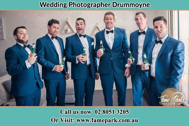 The groom and his groomsmen striking a wacky pose in front of the camera Drummoyne NSW 2047