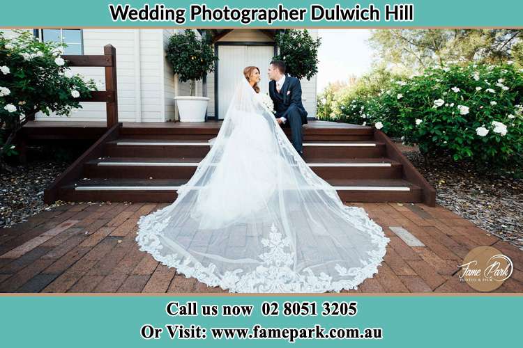 Photo of the Bride and the Groom looking each other while sitting at the staircase Dulwich Hill NSW 2203