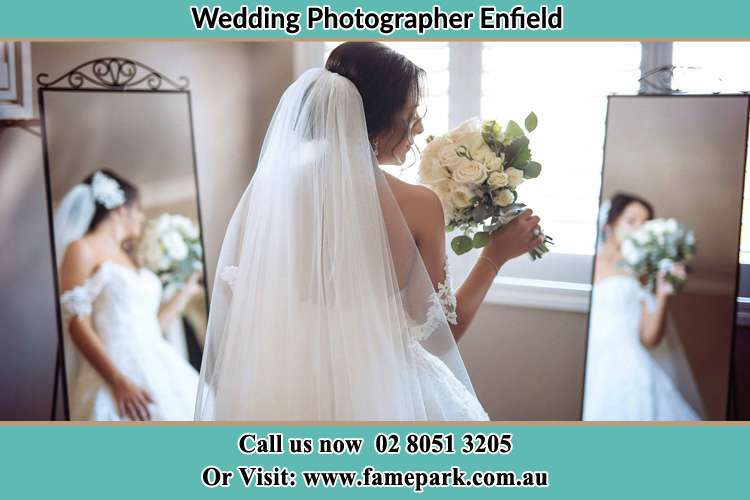 Photo of the Bride holding flower at the front of the mirrors Enfield NSW 2136