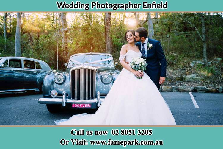 Photo of the Bride and the Groom at the front of the bridal car Enfield NSW 2136