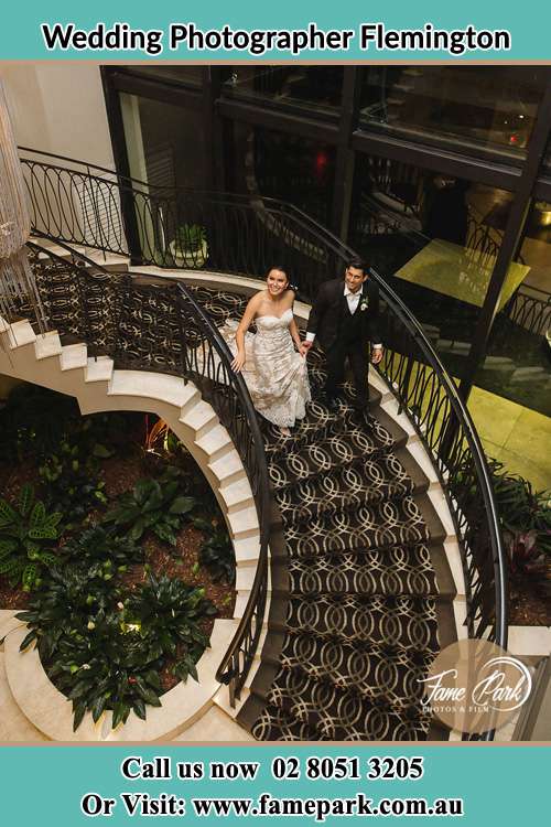 Photo of the Bride and the Groom going down the stair Flemington NSW 2140