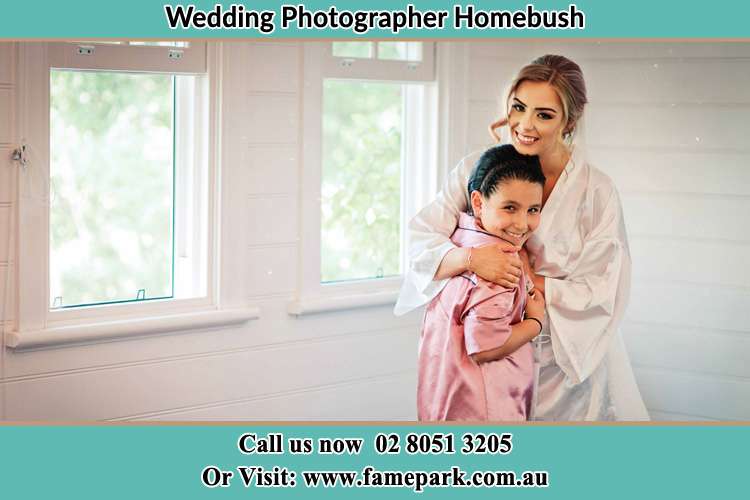 Photo of the Bride hugging the flower girl Homebush NSW 2140