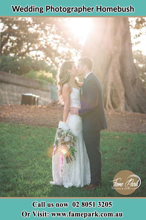 Photo of the Bride and the Groom kissing at the yard Homebush NSW 2140