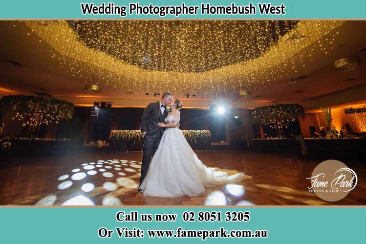 Photo of the Groom and the Bride kissing on the dance floor Homebush West NSW 2140