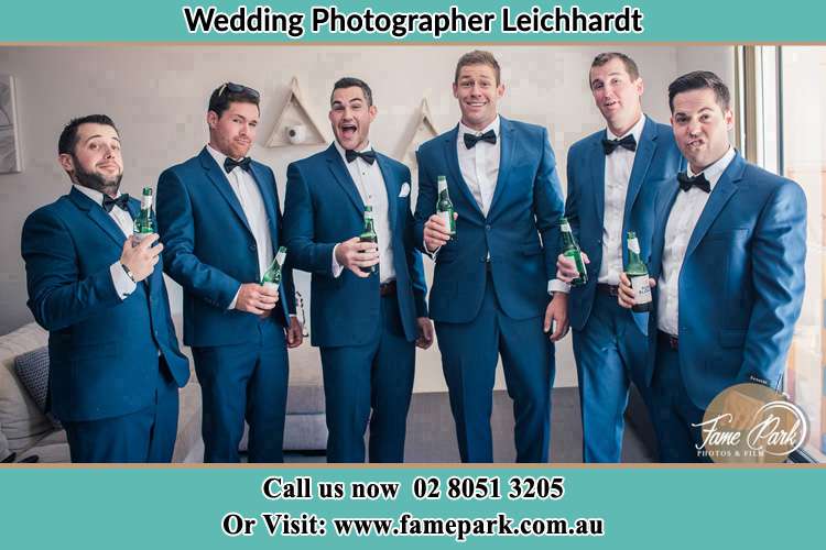 The groom and his groomsmen striking a wacky pose in front of the camera Leichhardt NSW 2040