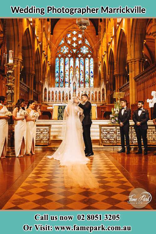 Photo of the Groom and the Bride with the entourage at the altar Marrickville NSW 2204