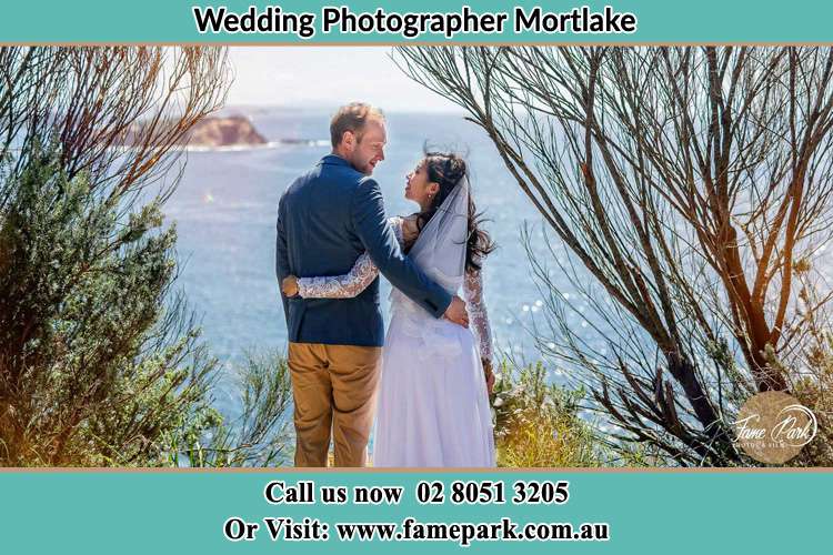 Photo of the Groom and the Bride looking each other near the sea front Mortlake NSW 2137