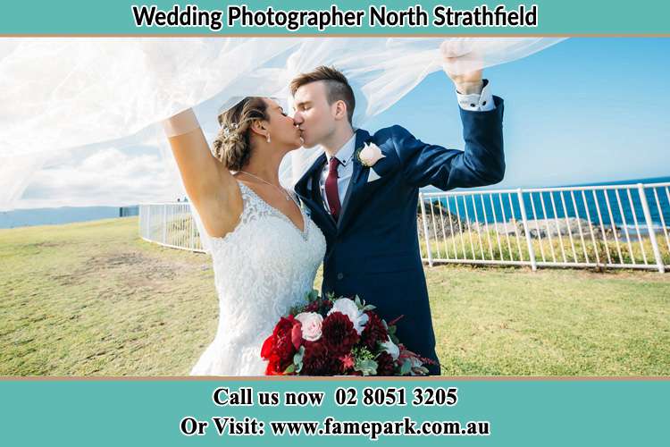 Photo of the Bride and the Groom kissing at the yard North Strathfield NSW 2137