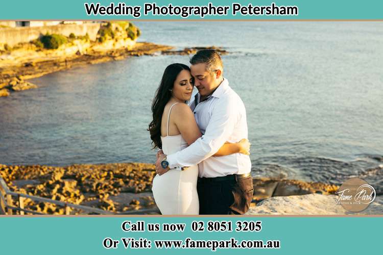 Photo of the Bride and the Groom hugging near the lake Petersham NSW 2049