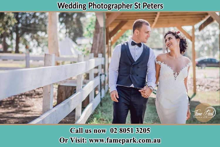 Photo of the Groom and the Bride holding hands while walking St Peters NSW 2044