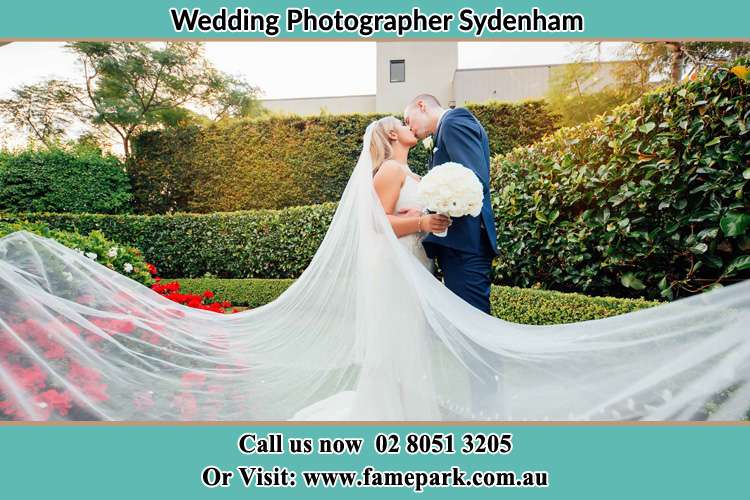 Photo of the Bride and the Groom kissing at the garden Sydenham NSW 2044