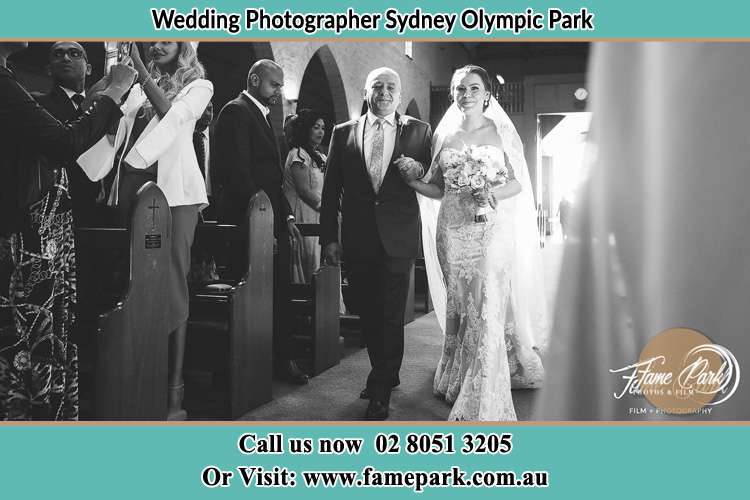 Photo of the Bride with her father walking the aisle Sydney Olympic Park NSW 2127