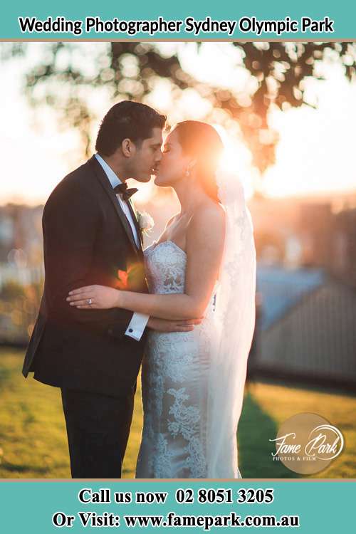 Photo of the Groom and the Bride kissing at the yard Sydney Olympic Park NSW 2127